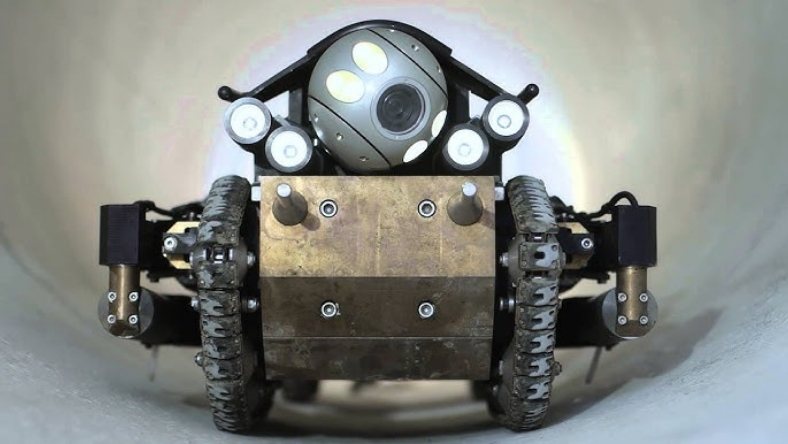 Robotic crawler inspecting interior of underground water pipeline